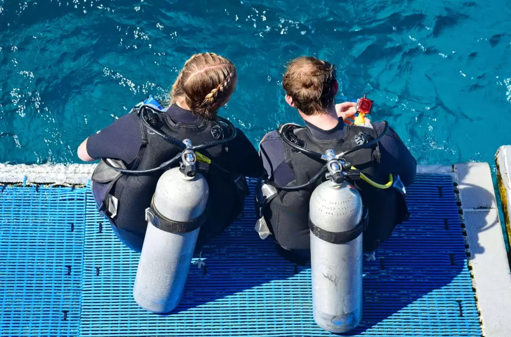 What is recognised as the most common method by which scuba divers enter the water from a boat